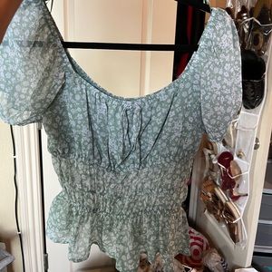 Francesca’s green floral top